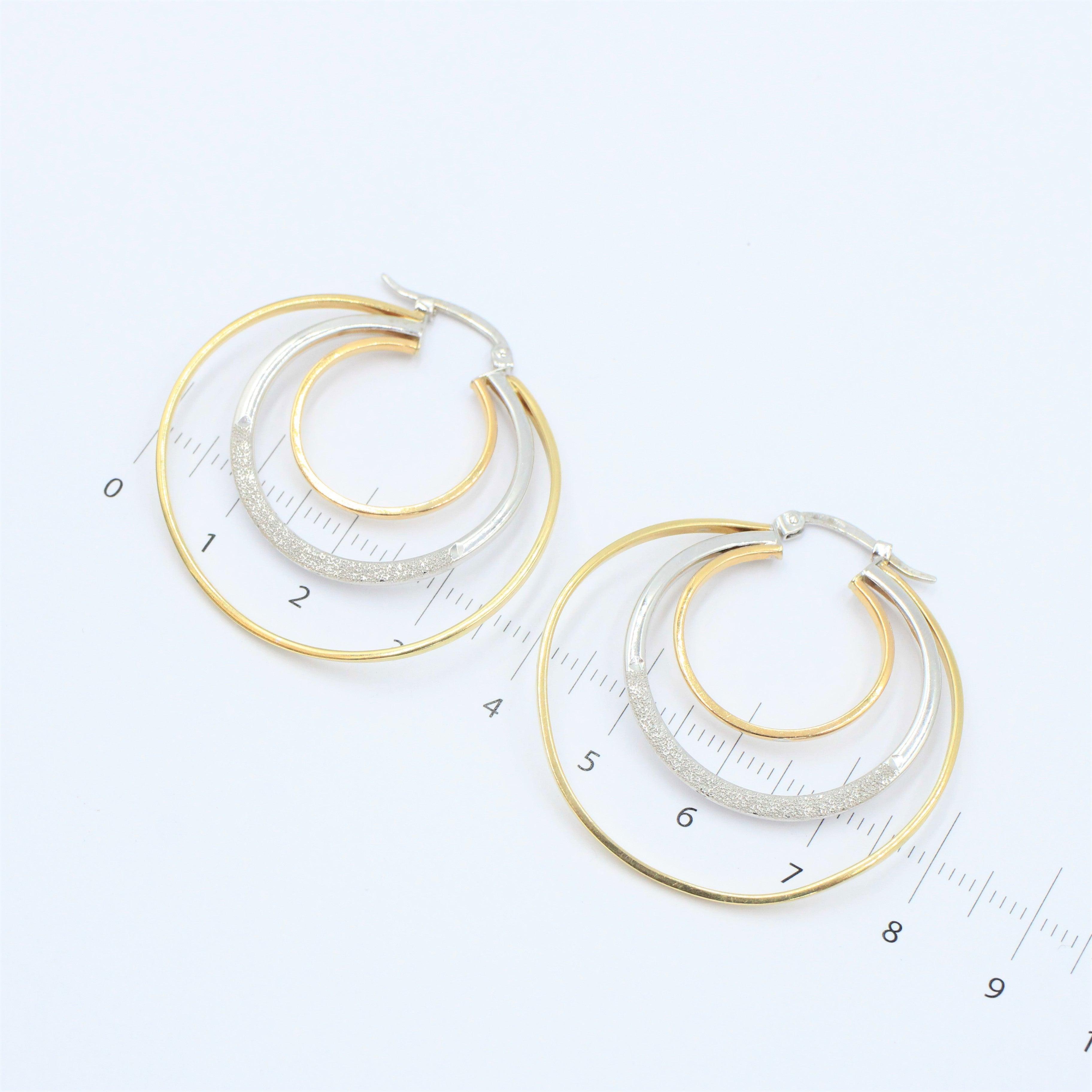 Arracadas oro blanco y amarillo hueca 14k - Orovel's Collection