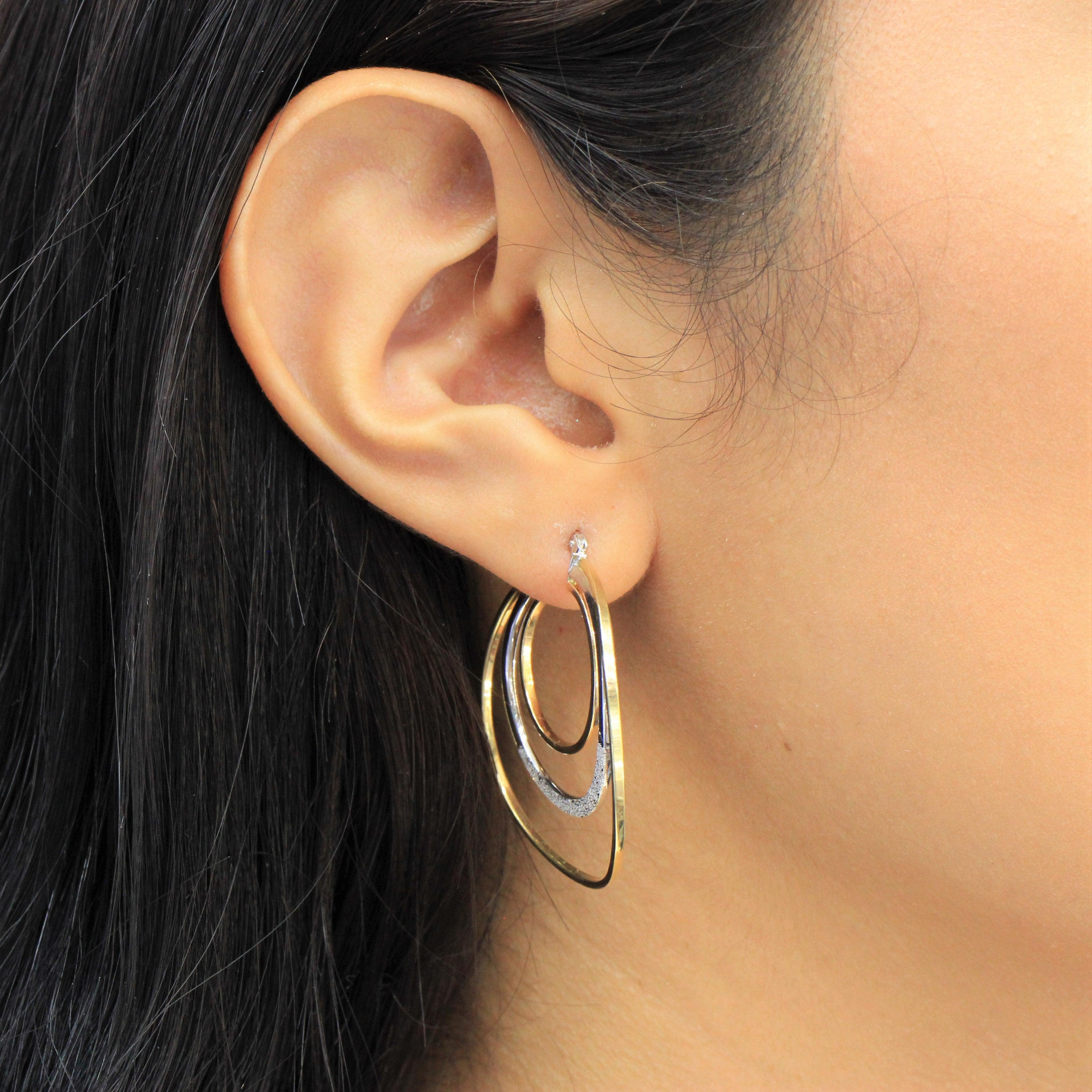 Arracadas oro blanco y amarillo hueca 14k - Orovel's Collection