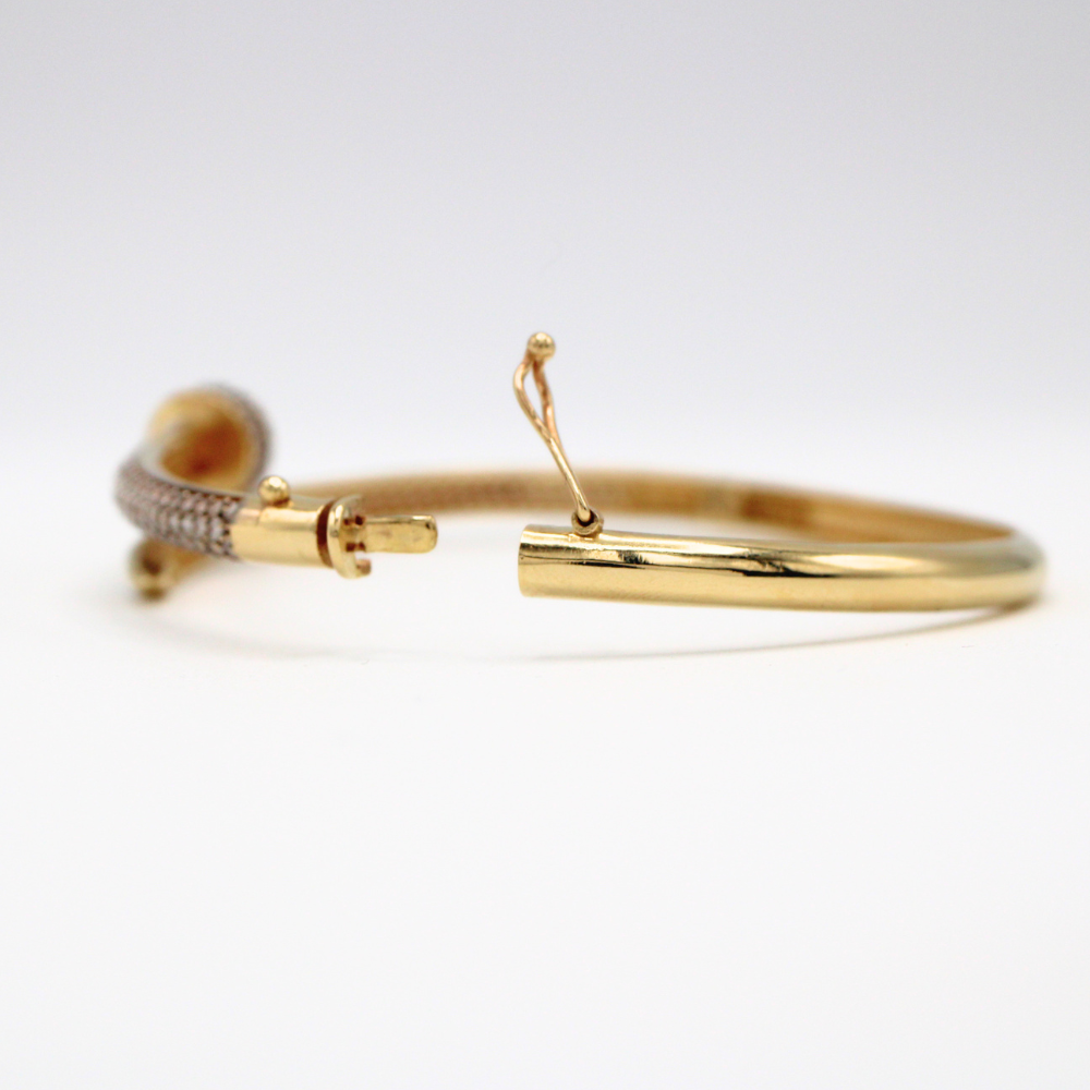 ARO CLAVO CON ZIRCONIAS ORO 14K