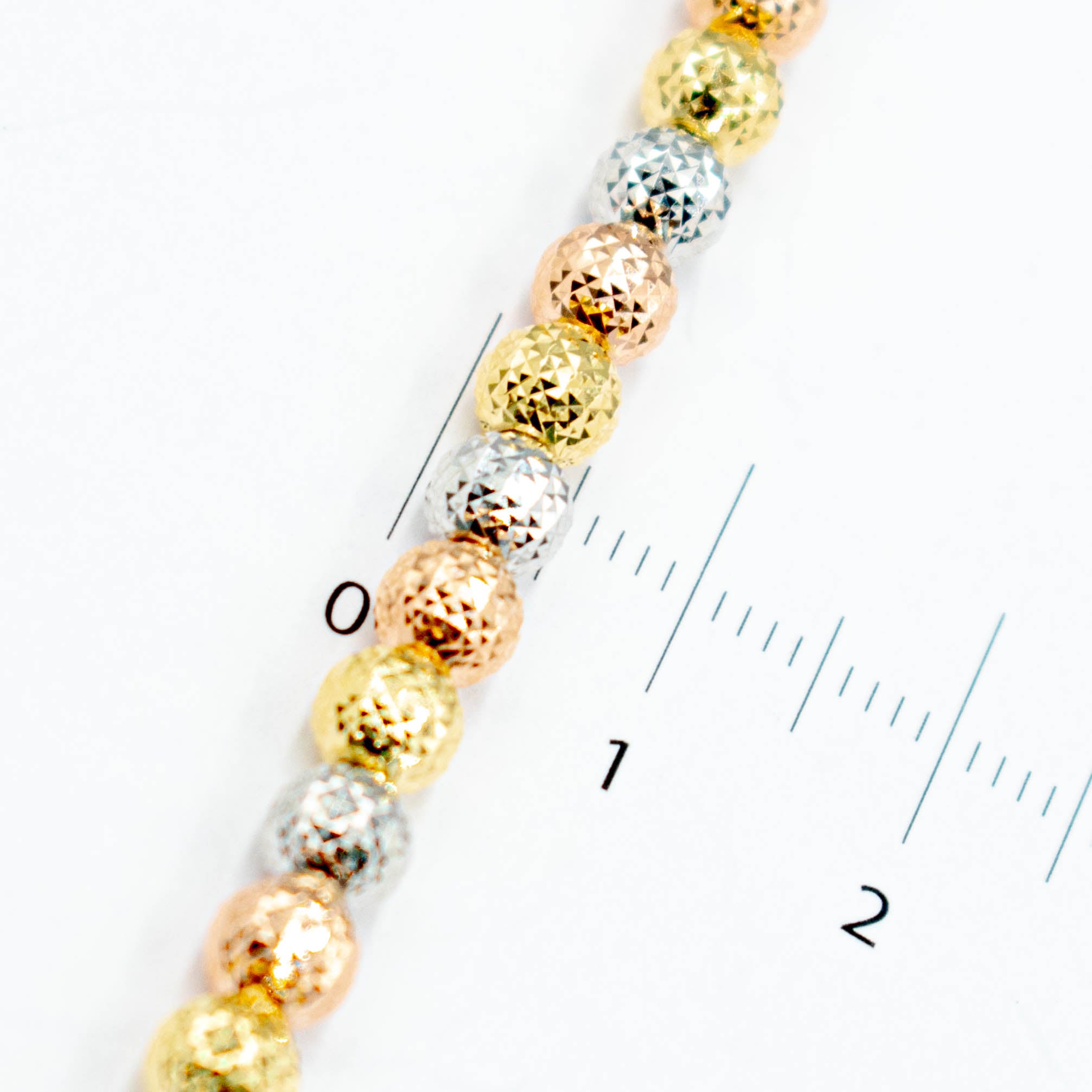 PULSERA  CON BOLAS DIAMANTADAS TRES ORO 14K