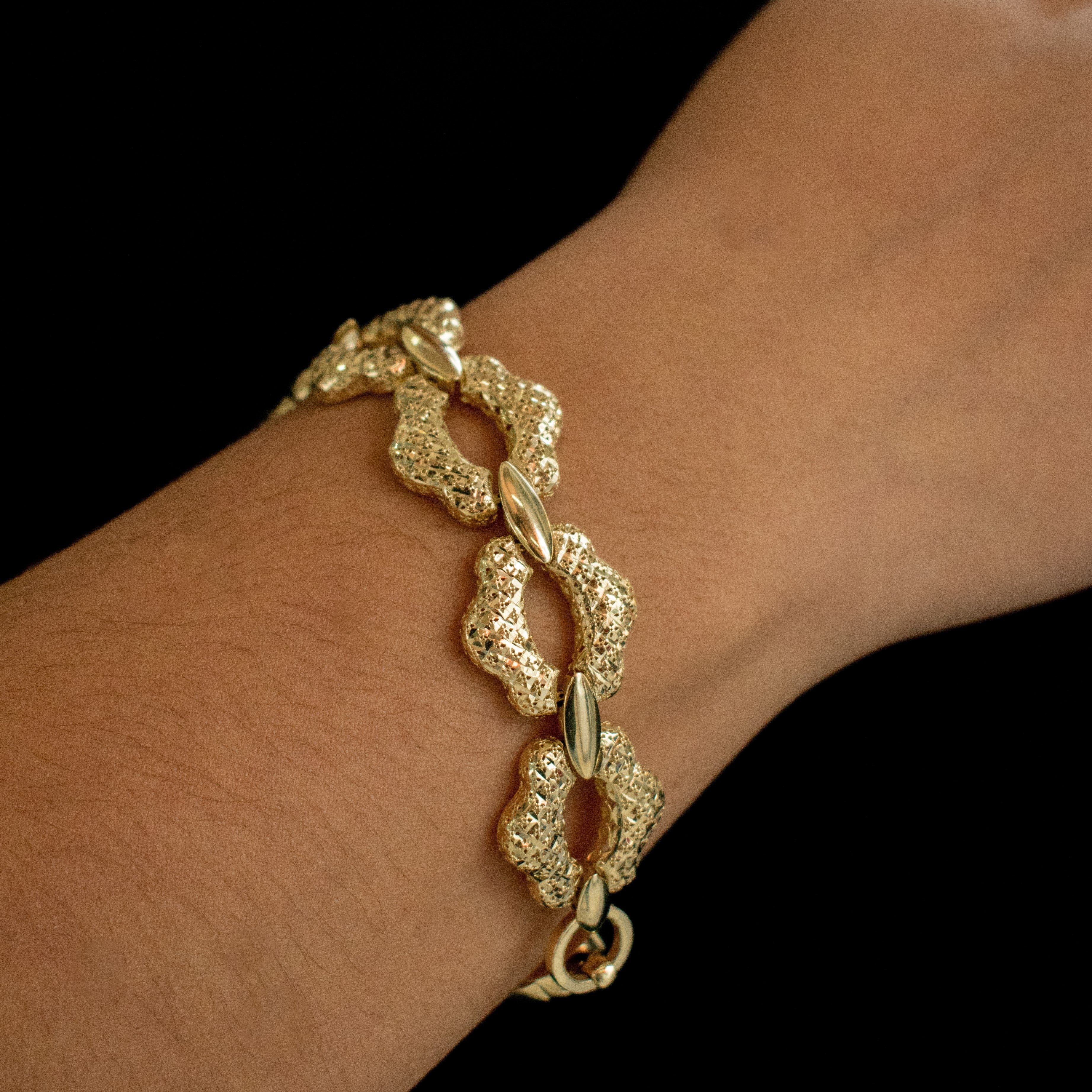 PULSERA MONACO TEJIDO FLOR DIAMANTADA HUECO ORO 14K