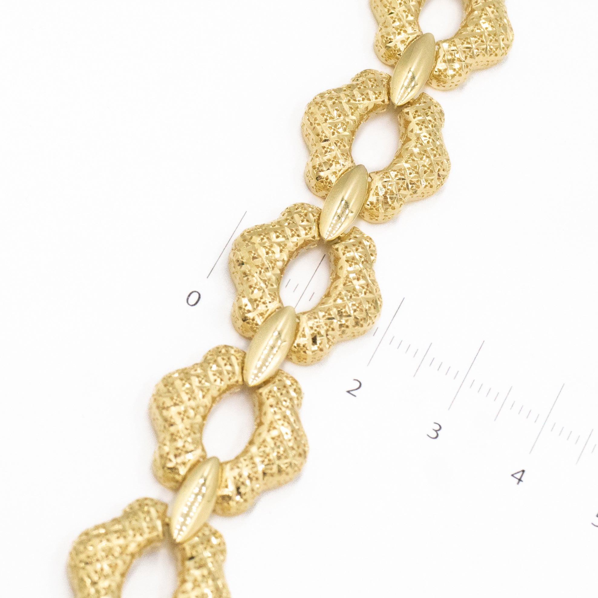 PULSERA MONACO TEJIDO FLOR DIAMANTADA HUECO ORO 14K