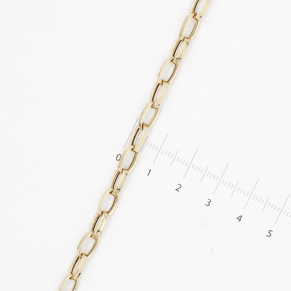 PULSERA HUECA CON DIJES COLGANTES MARCA DE DISEÑADOR ORO 14K